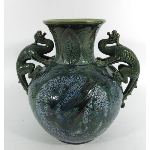 1250 - James Dewdney for C H Brannam, an art pottery twin handled dragon vase, 1898, ovoid form with flared... 