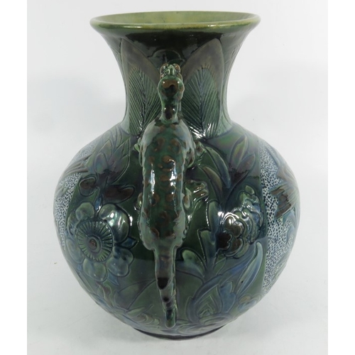 1250 - James Dewdney for C H Brannam, an art pottery twin handled dragon vase, 1898, ovoid form with flared... 