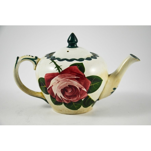 1252 - George Stewart for Pountney, a Bristol pottery rose painted teapot, circa 1905, in the Wemyss style,... 