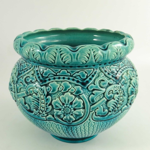 1253 - A Burmantofts Faience Jardiniere and Stand, the turquoise glazed moulded floral and leaf decorated j... 