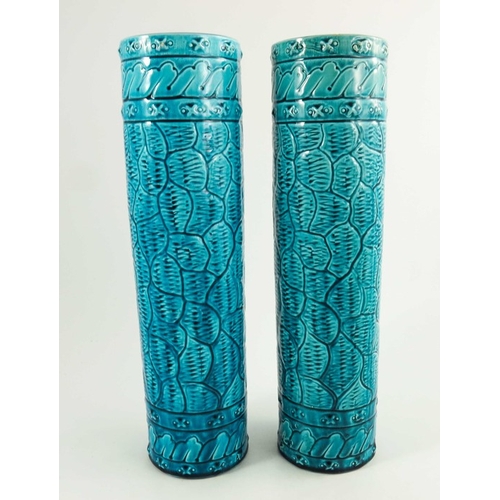 1254 - A Pair of Burmantofts Faience Turquoise Glazed Cylindrical Vases, circa 1880, decorated in low relie... 