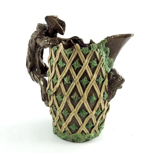 1263 - Edward Bingham for Castle Hedingham, an art pottery jug, lattice and foliate decoration with figural... 