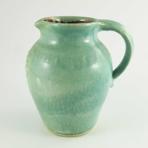 1264 - William Fishley Holland, an art pottery jug, circa 1930, green glazed shouldered form, incised signa... 