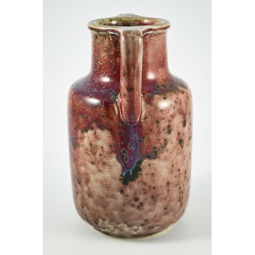 1342 - A Ruskin high fired twin handled vase, circa 1925, cylindrical shouldered form with angled handles, ... 