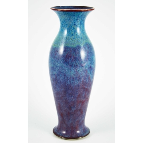 1352 - A Ruskin high fired vase, 1913, shouldered elongated baluster form, blue draining to purple, impress... 