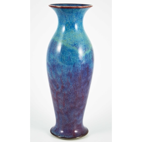 1352 - A Ruskin high fired vase, 1913, shouldered elongated baluster form, blue draining to purple, impress... 