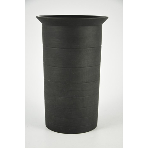 1397 - Nick Munro for Wedgwood, a black basalt cylinder vase, 1999, incised concentric ring decoration and ... 