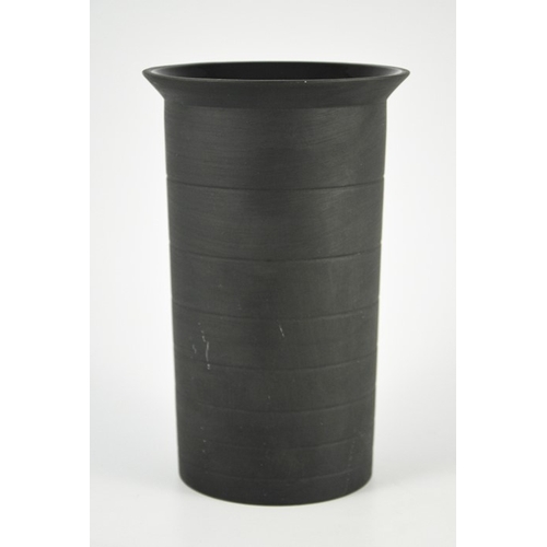 1397 - Nick Munro for Wedgwood, a black basalt cylinder vase, 1999, incised concentric ring decoration and ... 