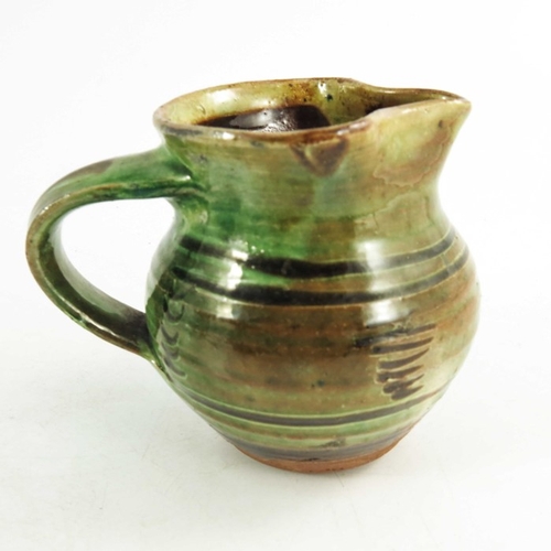 1405 - Sid Tustin for Winchcombe, three graduated studio pottery slip glazed jugs, spiral, line and wave de... 