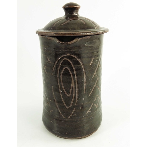 1412 - Michael Cardew for Wenford Bridge, a studio pottery jug and cover, incised with spiral and crosshatc... 