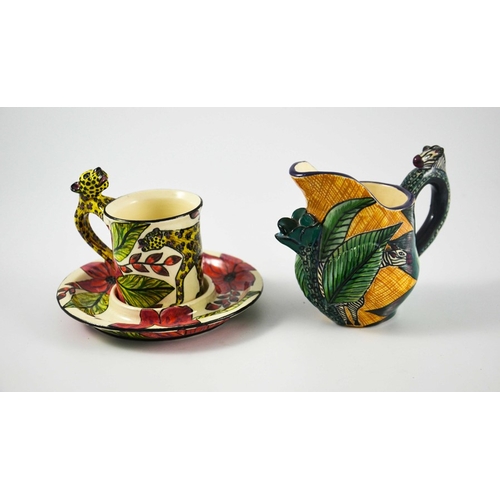 1413 - Ardmore Studio, a South African pottery jug and coffee can and saucer, 2000 and 2008, relief moulded... 