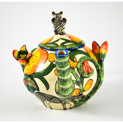 1415 - Ardmore Studio, a South African pottery teapot, 2002, relief moulded and painted with zebras and flo... 