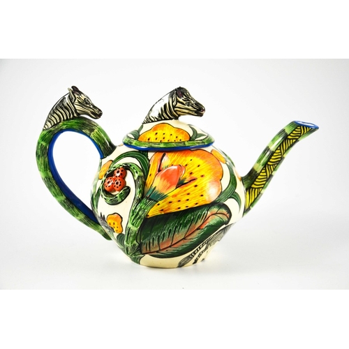 1415 - Ardmore Studio, a South African pottery teapot, 2002, relief moulded and painted with zebras and flo... 