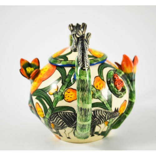 1415 - Ardmore Studio, a South African pottery teapot, 2002, relief moulded and painted with zebras and flo... 