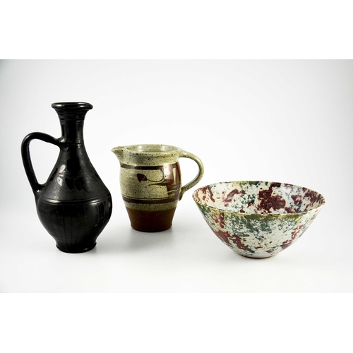 1416 - Studio pottery including Donald Granville jug, a mottled slip decorated bowl, and a Nigerian black w... 