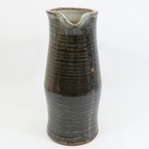 1418 - Michael Cole, a large studio pottery flagon or jug, ribbed cylindrical form, impressed mark, circa 1... 