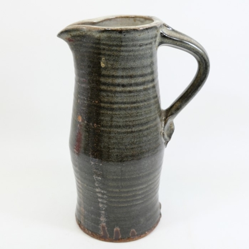 1418 - Michael Cole, a large studio pottery flagon or jug, ribbed cylindrical form, impressed mark, circa 1... 