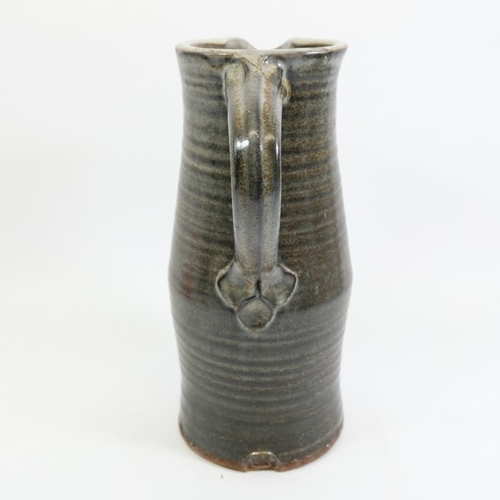 1418 - Michael Cole, a large studio pottery flagon or jug, ribbed cylindrical form, impressed mark, circa 1... 