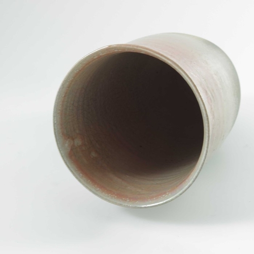 1421 - Gerry Unsworth, a studio pottery raku vase, elongated amphora form, crackled pink lustre glaze over ... 