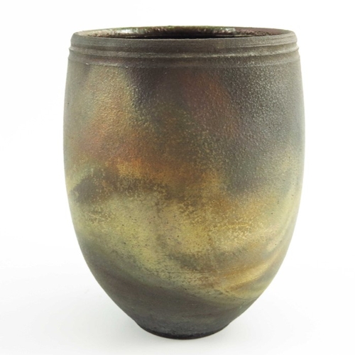 1425 - Simon Rich, a studio pottery fumed raku vase, rounded beaker form with incised band to rim, gold lus... 