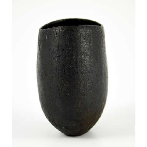 1433 - John Ward, a studio pottery vase, flattened ovoid form, black glazed, impressed seal mark, 12cm high