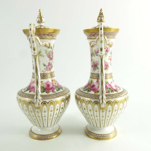 1435 - A pair of Spode Copeland vases, circa 1920, baluster form with twin handles, hand painted with spray... 