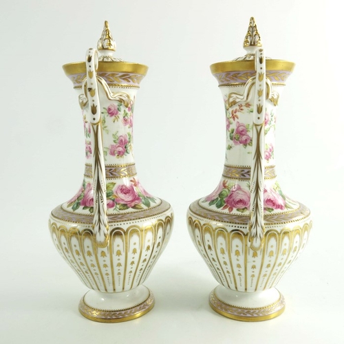 1435 - A pair of Spode Copeland vases, circa 1920, baluster form with twin handles, hand painted with spray... 