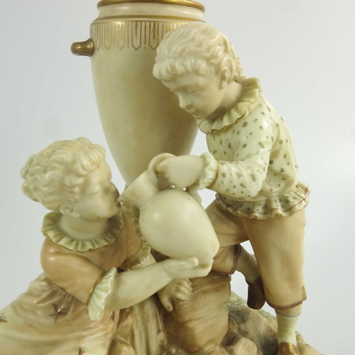 1445 - A Royal Worcester blush ivory ground figure group vase, circa 1888, after a model by James Hadley, m... 