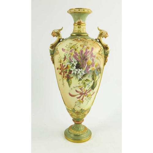 1447 - A Royal Worcester blush ivory ground two handled urn shape vase florally decorated in coloured ename... 