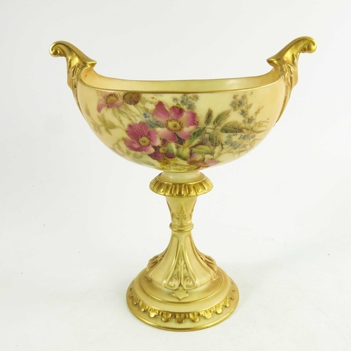 1455 - A Royal Worcester blush ivory oval pedestal vase, the oval boat shape body raised on a fluted, gilt ... 