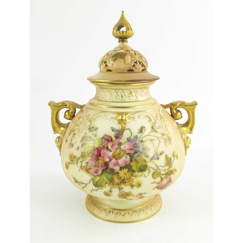 1458 - A Royal Worcester blush ivory ground globular pot pourri two handled jar and cover, decorated with d... 