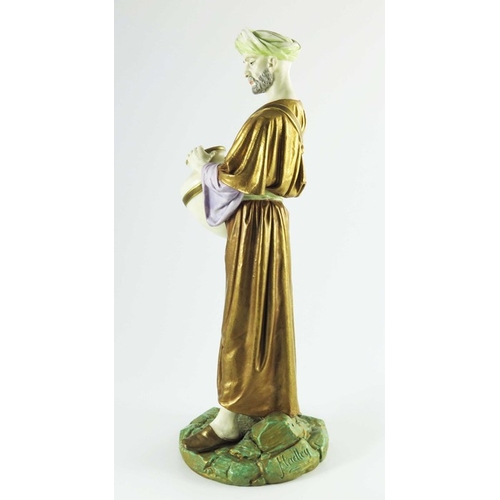 1462 - James Hadley for Royal Worcester, a water carrier figure, 1884, modelled in Middle Eastern costume c... 