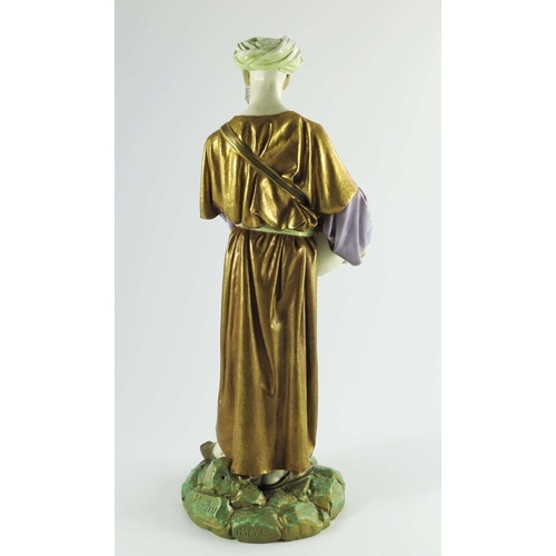 1462 - James Hadley for Royal Worcester, a water carrier figure, 1884, modelled in Middle Eastern costume c... 