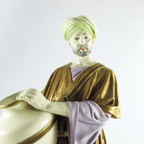 1462 - James Hadley for Royal Worcester, a water carrier figure, 1884, modelled in Middle Eastern costume c... 