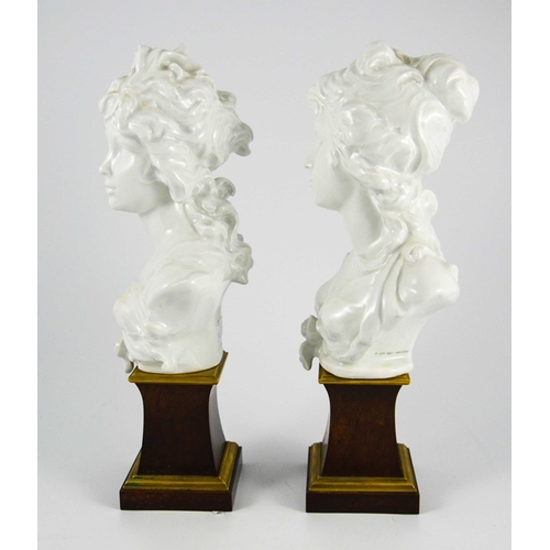 1471 - Arnold Machin O.B.E., R.A. for Royal Worcester, a pair of limited edition busts of 'Night and Day', ... 