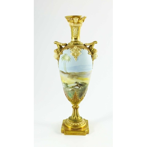 1472 - Walter Powell for Royal Worcester, a mask handle vase of slender ovoid form, painted with storks in ... 