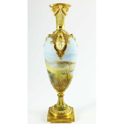 1472 - Walter Powell for Royal Worcester, a mask handle vase of slender ovoid form, painted with storks in ... 