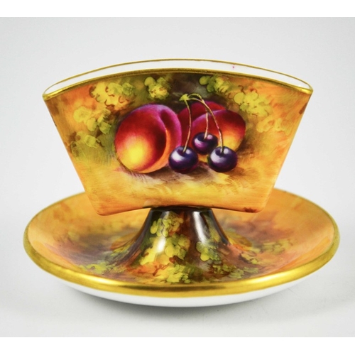 1487 - A Royal Worcester Cigarette Holder, 1931, hand painted and gilded, decorated with fruit on a natural... 