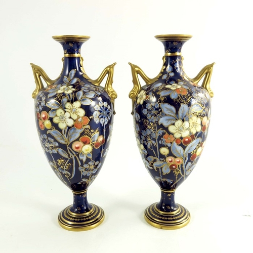 1502 - A pair of Crown Derby vases, circa 1920 twin handle pedestal form, painted flowers and foliage with ... 