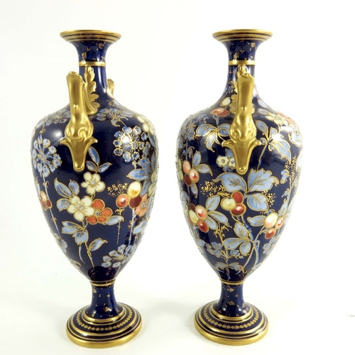 1502 - A pair of Crown Derby vases, circa 1920 twin handle pedestal form, painted flowers and foliage with ... 