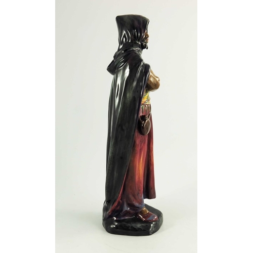 1507 - A Royal Doulton figure, HN1657, introduced 1938, painted green, red and blue cloack, orange, yellow ... 