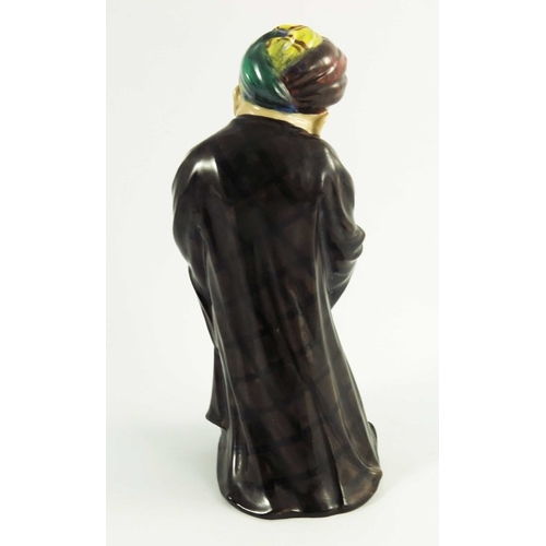 1508 - A Royal Doulton figure, One Of The Forty HN500, introduced 1921, painted brown cloack, orange, yello... 