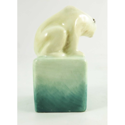 1509 - A Royal Doulton figure, circa 1920, a polar bear on a cube, 10cm high