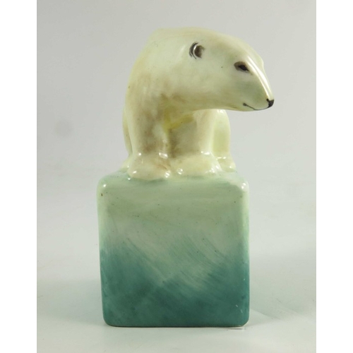 1509 - A Royal Doulton figure, circa 1920, a polar bear on a cube, 10cm high