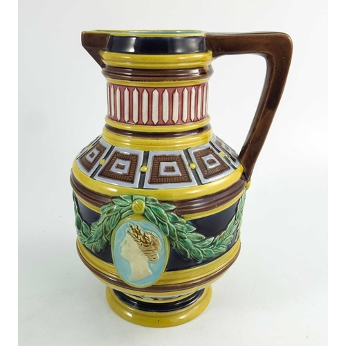 1513 - A Wedgwood majolica jug, circa 1870, cylindrical baluster form, relief moulded with classical portra... 