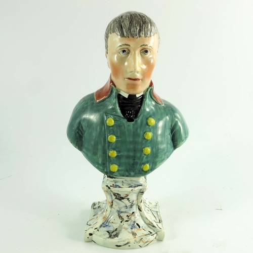 1529 - A Staffordshire bust of Napoleon, circa 1820, modelled in green uniform on a marbled plinth, 28cm hi... 