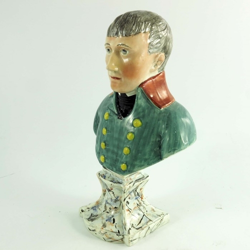 1529 - A Staffordshire bust of Napoleon, circa 1820, modelled in green uniform on a marbled plinth, 28cm hi... 