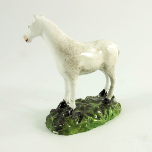 1537 - A Derby porcelain figure of a horse, circa 1770, modelled standing, 10cm high