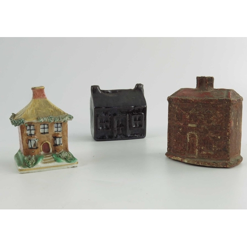 1545 - A group of Staffordshire cottage money boxes, circa 1900, two with encrusted floral decoration and o... 