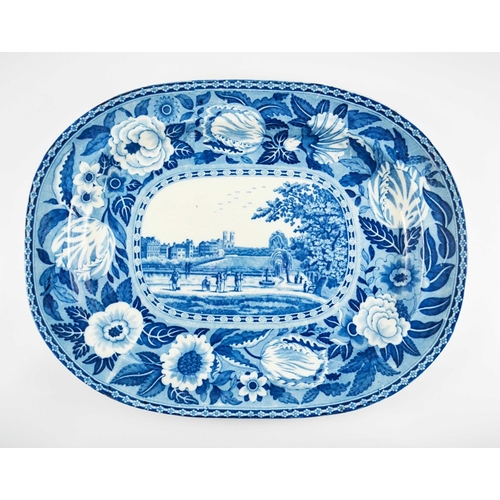 1554 - An Early 19th Century Blue and White Oval Meat Platter, circa 1820, the tulip border surrounding a f... 